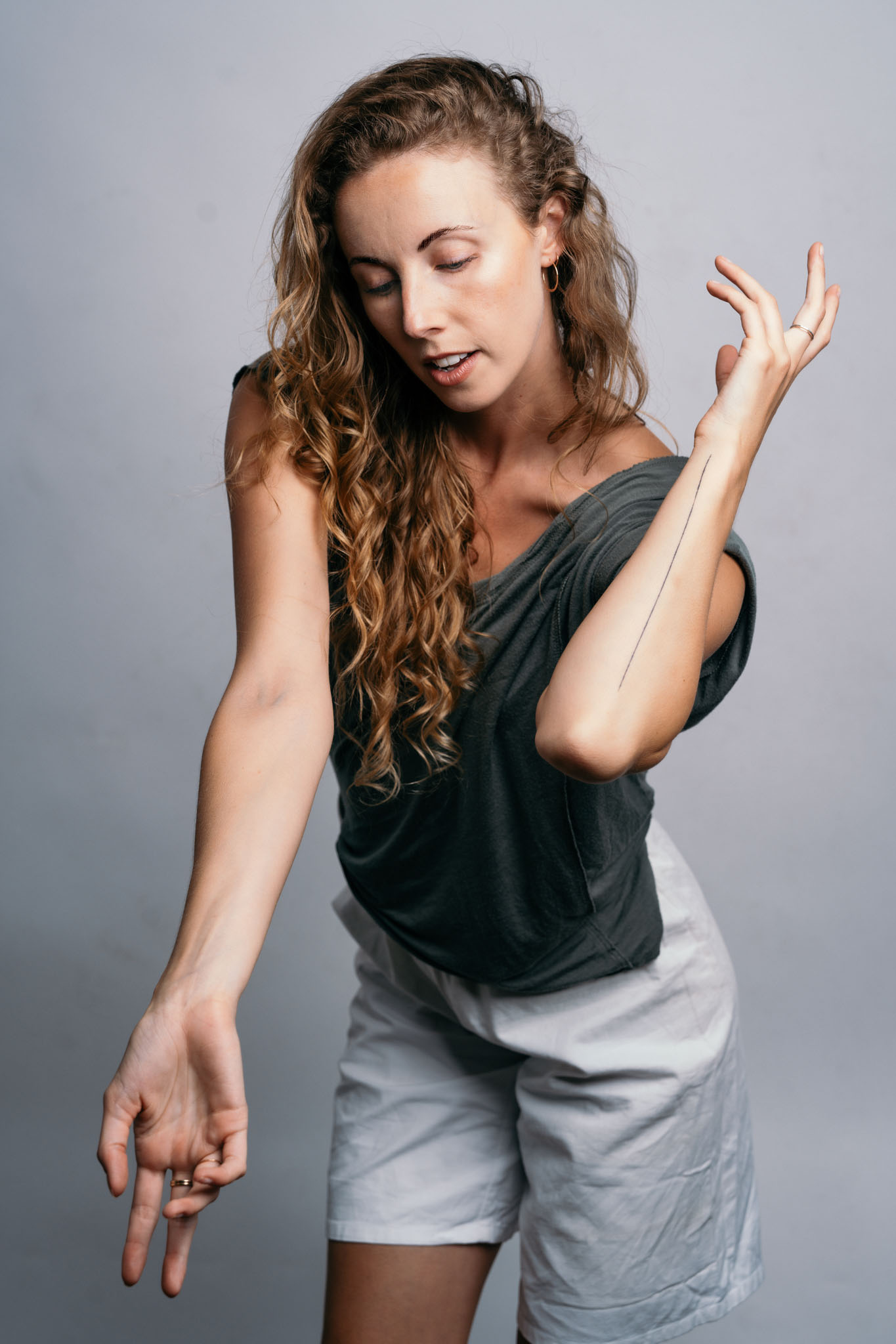 headshot of Francesca Dominguez. She is moving her arms